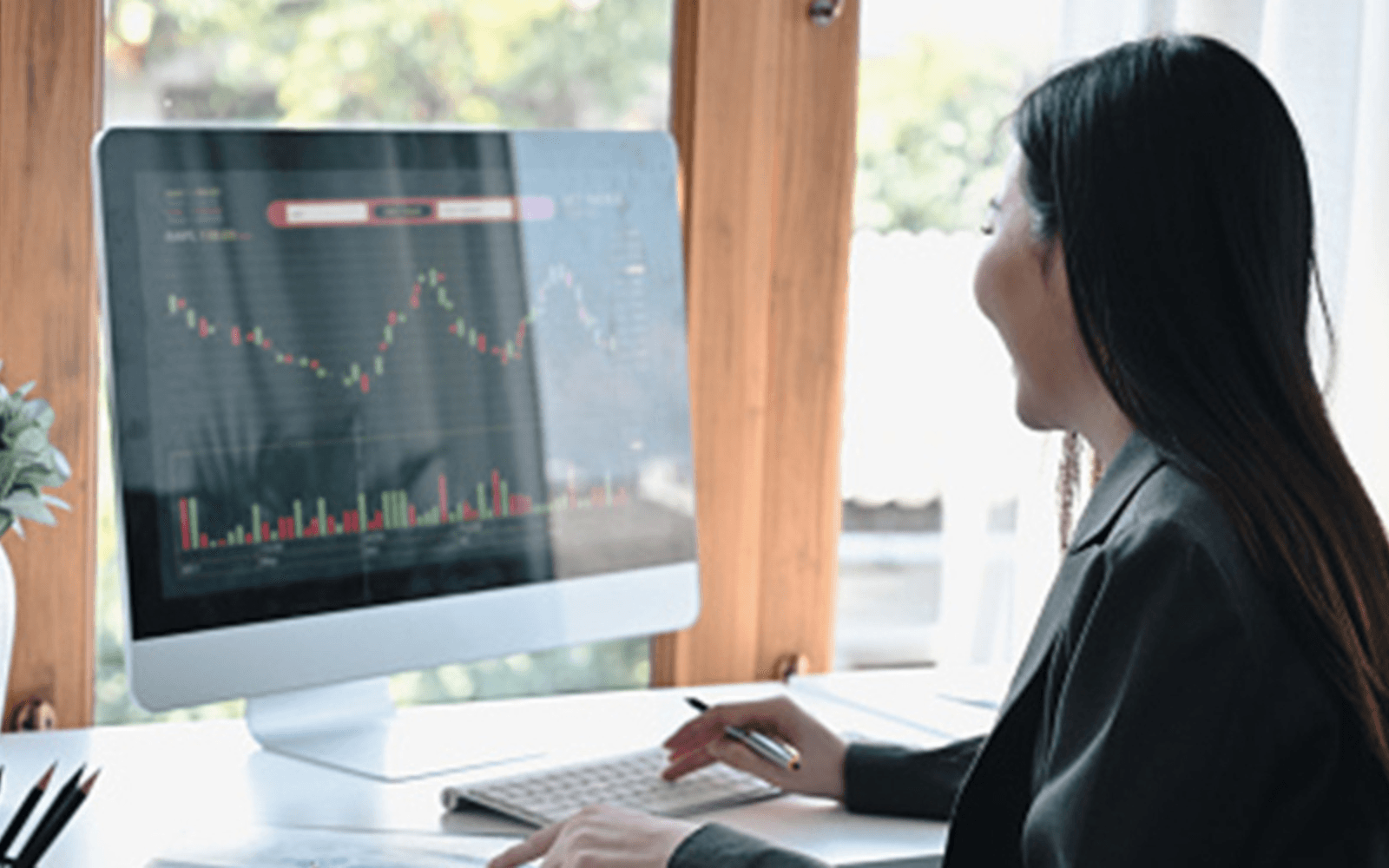 IG banner female looking at stocks